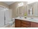 Primary bathroom has a double sink vanity, glass shower, and tile flooring at 4124 Sykes St, Cary, NC 27519