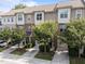 Street view of townhomes featuring neat landscaping and attached garages for convenient parking at 4124 Sykes St, Cary, NC 27519