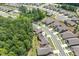 Aerial view of the community showcases lush greenery, neighborhood and surrounding wooded area at 428 Crayton Oak Dr, Cary, NC 27519