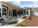 Beautiful back patio with lounge chairs, outdoor seating, and a well-manicured yard at 428 Crayton Oak Dr, Cary, NC 27519