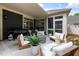 Inviting outdoor patio area with comfortable seating, barbecue grill, and a cozy atmosphere at 428 Crayton Oak Dr, Cary, NC 27519