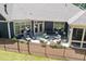 Aerial view of backyard with a patio, lounge chairs, outdoor grill, and a fenced-in area at 428 Crayton Oak Dr, Cary, NC 27519