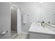 Clean bathroom featuring tiled shower, modern vanity, and neutral color palette at 428 Crayton Oak Dr, Cary, NC 27519