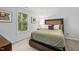 Cozy bedroom with a plush bed, framed art and a window letting in natural light at 428 Crayton Oak Dr, Cary, NC 27519