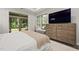 Relaxing bedroom that has access to a private outdoor patio with forest views at 428 Crayton Oak Dr, Cary, NC 27519