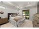 Comfortable bedroom with trey ceiling, large windows, and neutral decor at 428 Crayton Oak Dr, Cary, NC 27519