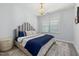 Inviting bedroom with large bed, stylish headboard, and natural light at 428 Crayton Oak Dr, Cary, NC 27519