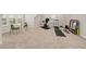 Bonus room with exercise equipment, comfortable seating area and bright natural light at 428 Crayton Oak Dr, Cary, NC 27519