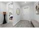 Bright entryway with gray wood floors and views into bedroom at 428 Crayton Oak Dr, Cary, NC 27519