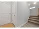 Entry hallway with two coat closets near the front door and carpeted stairs at 428 Crayton Oak Dr, Cary, NC 27519