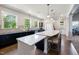 Community kitchen with a large island, modern appliances, and ample counter space for food preparation at 428 Crayton Oak Dr, Cary, NC 27519