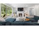Inviting living room with a fireplace, large windows, and stylish, comfortable furniture arrangement at 428 Crayton Oak Dr, Cary, NC 27519