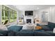Inviting living room with a fireplace, large windows, and stylish, comfortable furniture arrangement at 428 Crayton Oak Dr, Cary, NC 27519