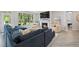 Stylish living room with fireplace, large windows and plush seating at 428 Crayton Oak Dr, Cary, NC 27519