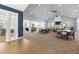 Spacious community lounge featuring a fireplace, TV, ample seating, and access to a kitchen area at 428 Crayton Oak Dr, Cary, NC 27519