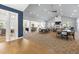Spacious community lounge featuring a fireplace, TV, ample seating, and access to a kitchen area at 428 Crayton Oak Dr, Cary, NC 27519