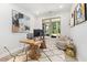 Bright home office space with a large window, wooden desk, and comfortable seating area at 428 Crayton Oak Dr, Cary, NC 27519