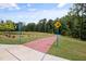 Scenic walking path with brick accents, a pond, landscaping, and mature trees surrounding the path at 428 Crayton Oak Dr, Cary, NC 27519