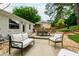 The home's outdoor space features seating, dining, and lovely landscaping to enjoy nature at 433 Rosehaven Dr, Raleigh, NC 27609