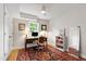 Bedroom featuring a desk, chair, bookshelf, and a large area rug with an overhead ceiling fan at 433 Rosehaven Dr, Raleigh, NC 27609