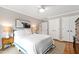 Bedroom with neutral walls, hardwood floors, closet and natural light at 433 Rosehaven Dr, Raleigh, NC 27609