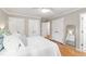 Bright bedroom with hardwood floors, three closets, and plenty of natural light at 433 Rosehaven Dr, Raleigh, NC 27609