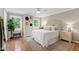 Charming bedroom with hardwood floors, neutral walls, and natural light at 433 Rosehaven Dr, Raleigh, NC 27609