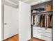 Walk in closet with storage shelves and hanging rods for organization and convenience at 433 Rosehaven Dr, Raleigh, NC 27609