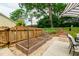Backyard with garden beds, a basketball hoop and a step-stone staircase at 433 Rosehaven Dr, Raleigh, NC 27609
