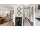 Stylish hallway with decorative plates on the wall and views into the living room and kitchen at 433 Rosehaven Dr, Raleigh, NC 27609