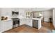 Well-appointed kitchen with stainless steel appliances, quartz countertops, and ample storage at 433 Rosehaven Dr, Raleigh, NC 27609