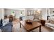 Comfortable living room featuring an open layout to the kitchen and dining area at 433 Rosehaven Dr, Raleigh, NC 27609
