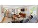 Cozy living room featuring a fireplace, comfortable seating, and an open layout at 433 Rosehaven Dr, Raleigh, NC 27609