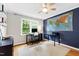 Office with hardwood floors, grey walls, world map and natural light at 433 Rosehaven Dr, Raleigh, NC 27609