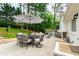 Outdoor patio with dining table, chairs, and umbrella, perfect for entertaining guests at 433 Rosehaven Dr, Raleigh, NC 27609
