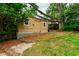 A backyard storage shed with double doors to store lawn and garden equipment and tools at 433 Rosehaven Dr, Raleigh, NC 27609