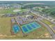 Aerial view of community with pond, pool, tennis and basketball courts, plus playground at 450 S Parliament Way, Clayton, NC 27520