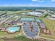 Aerial view of community with pool, tennis courts, basketball court and playground at 450 S Parliament Way, Clayton, NC 27520
