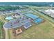 Aerial view of community with pool, tennis courts, basketball court and playground at 450 S Parliament Way, Clayton, NC 27520