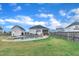 Expansive backyard featuring a pool, patio area, and lush lawn, perfect for outdoor relaxation and entertainment at 450 S Parliament Way, Clayton, NC 27520