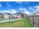 Expansive backyard featuring a sparkling pool, patio area, and lush lawn, perfect for outdoor living at 450 S Parliament Way, Clayton, NC 27520
