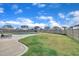 Lush backyard with an in-ground pool, manicured lawn, and privacy fence, creating a serene outdoor retreat at 450 S Parliament Way, Clayton, NC 27520