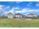 Expansive backyard showcasing an in-ground pool, patio area for outdoor dining, and privacy fencing for leisure and entertainment at 450 S Parliament Way, Clayton, NC 27520