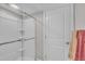Clean bathroom featuring a modern shower with glass door and white door, enhanced by bright, neutral decor at 450 S Parliament Way, Clayton, NC 27520
