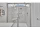 Bathroom featuring a large glass enclosed shower with bench and wall niche at 450 S Parliament Way, Clayton, NC 27520