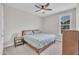 Bedroom featuring neutral walls, a ceiling fan, and a queen bed at 450 S Parliament Way, Clayton, NC 27520