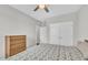 Bedroom featuring neutral walls, a ceiling fan, and a queen bed at 450 S Parliament Way, Clayton, NC 27520