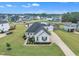 Inviting single-Gathering home boasts lush landscaping, a charming front porch, and an extended driveway in a desirable community at 450 S Parliament Way, Clayton, NC 27520