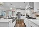 Well-equipped kitchen features modern appliances, white counters and cabinetry at 450 S Parliament Way, Clayton, NC 27520