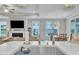 Bright open-concept kitchen featuring stainless steel sink, white countertop, and seamless transition to dining and living areas at 450 S Parliament Way, Clayton, NC 27520